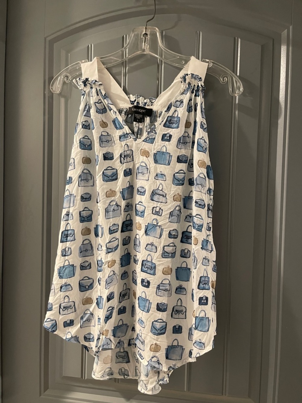 Karen Kane White Sleeveless Top with Blue Purse Print